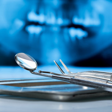 Dental equipment with an x-ray in the background