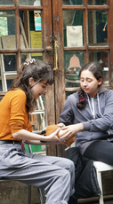 Two veterinary students holding a small animal